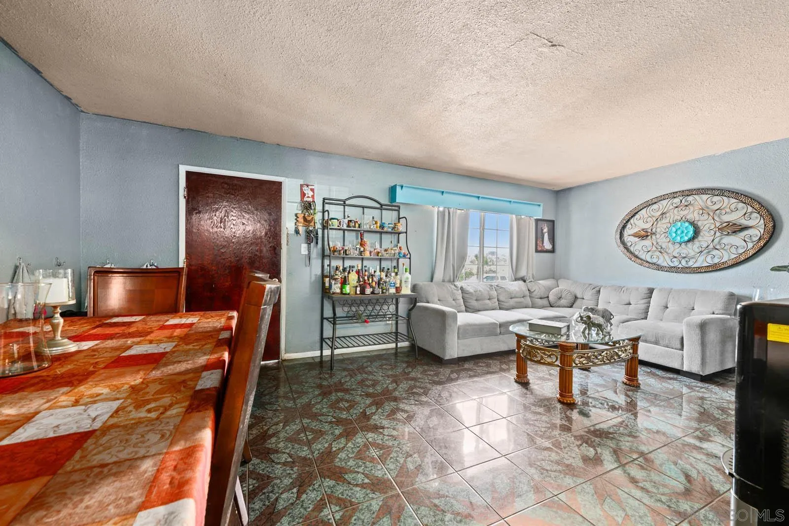 124 East View Street Fallbrook, CA 92028 - Photo 29 of 50 a living room with furniture and a large window