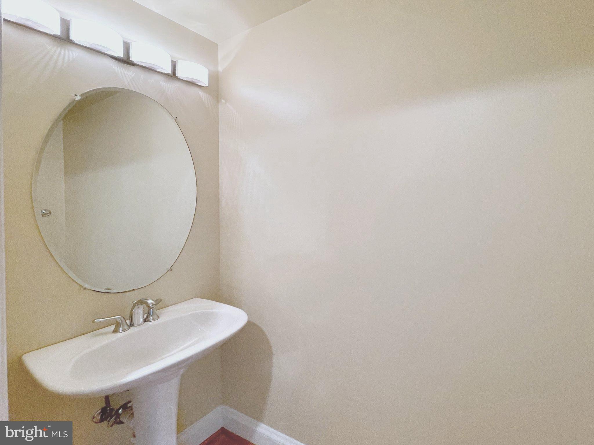 1555 North Colonial Terrace, Unit 600 Arlington, VA 22209 - Photo 13 of 29 a bathroom with a sink and a mirror