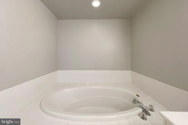 a bathroom with a sink a toilet and bathtub
