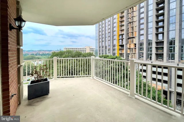 a view of a chairs and table in the patio
