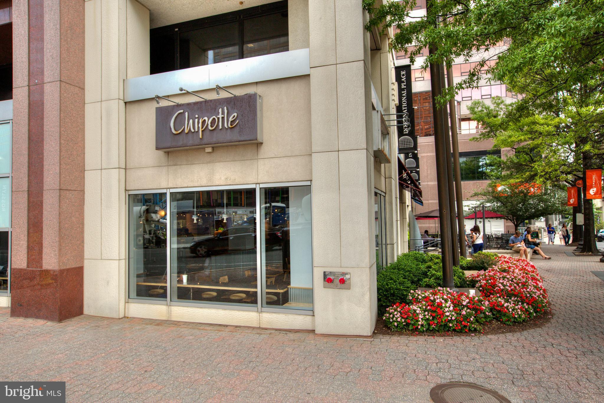 1555 North Colonial Terrace, Unit 600 Arlington, VA 22209 - Photo 28 of 29 a bunch of flowers in front of building