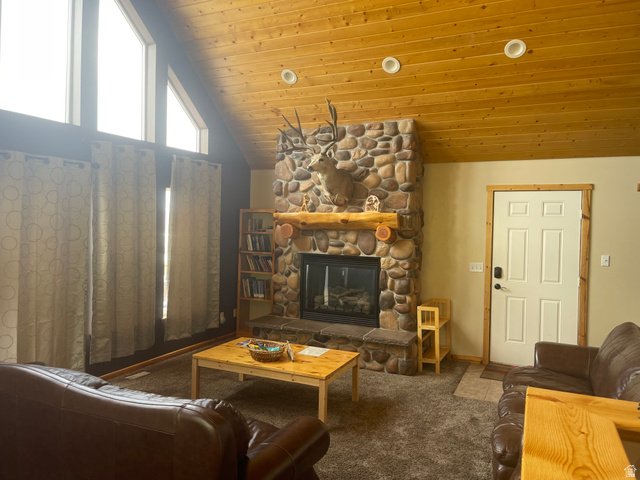 553 Raspberry Patch Road Garden City, UT 84028 - Photo 14 of 21 Carpeted living room with a fireplace, a vaulted wood ceiling, and recessed lighting