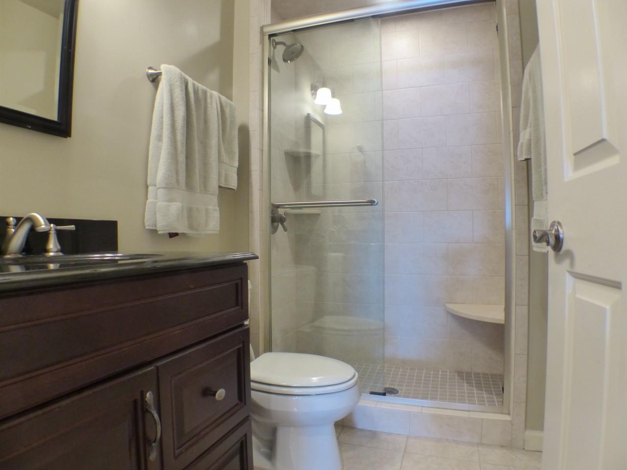 1100 Burning Tree Road Pinehurst, NC 28374 - Photo 15 of 28 Nice large vanity sink area and tiled shower is the guest bath for this home.