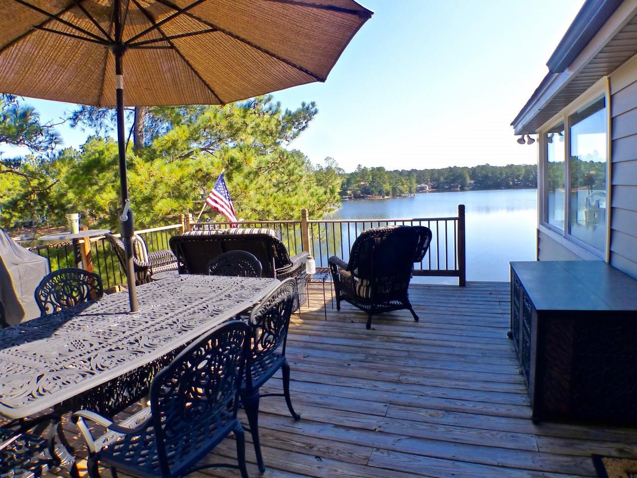 1100 Burning Tree Road Pinehurst, NC 28374 - Photo 19 of 28 This large deck is large enough for dining space and seating area. Enjoy entertaining on this deck.