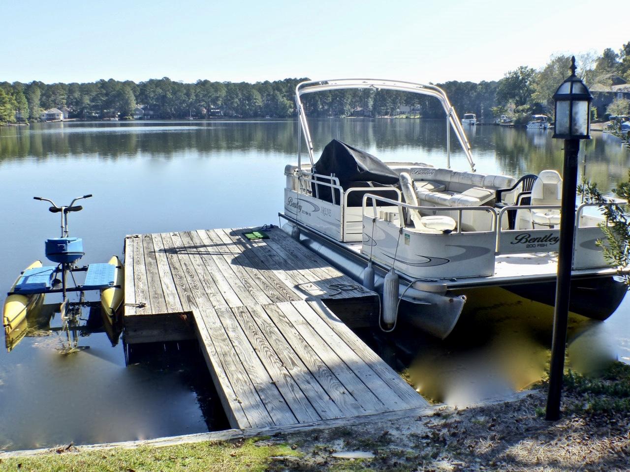 1100 Burning Tree Road Pinehurst, NC 28374 - Photo 20 of 28 The dock is great for fishing, or parking your boat.