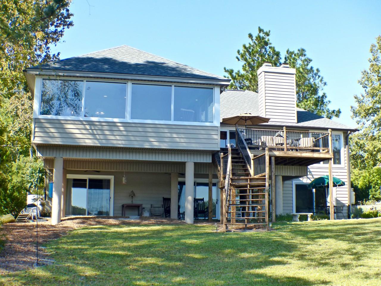 1100 Burning Tree Road Pinehurst, NC 28374 - Photo 25 of 28 The back exterior of this home has great windows and glass doors, offering the greatest lake views.