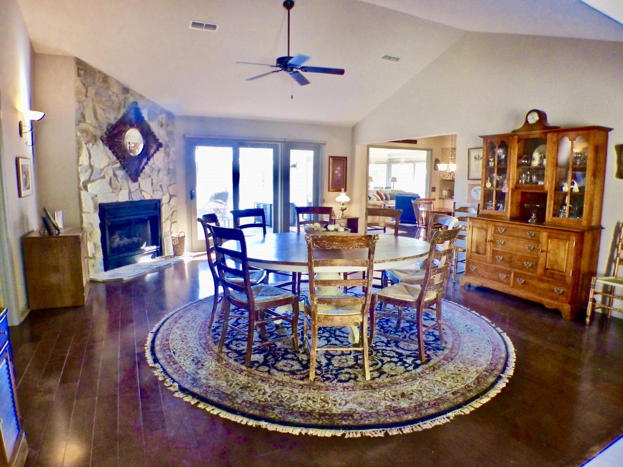 1100 Burning Tree Road Pinehurst, NC 28374 - Photo 5 of 28 Enter the home into this large living room with fireplace where the homeowner uses as a dinning area.
