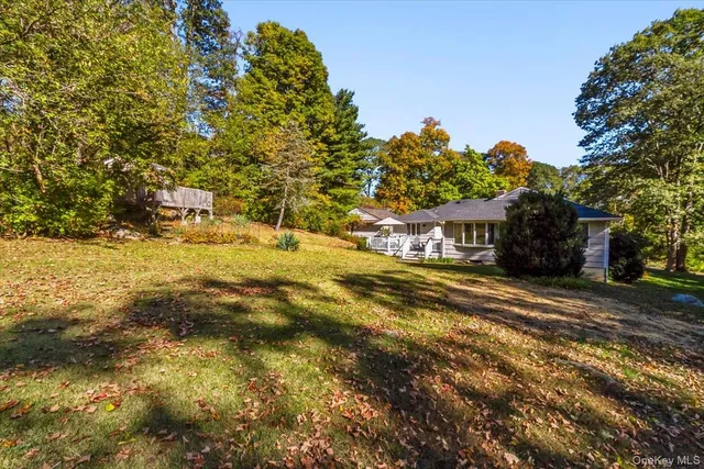 a swimming pool with trees in front of it