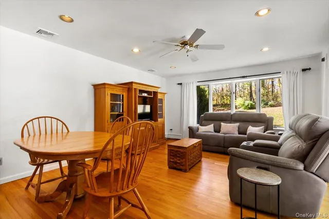 a living room with furniture a rug and a window