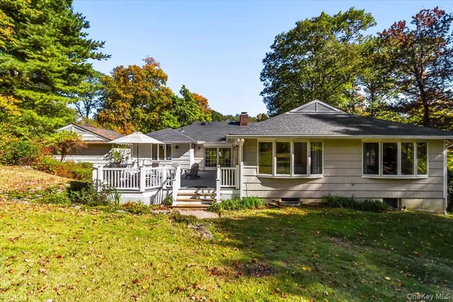 aerial view of a house with swimming pool and sitting area