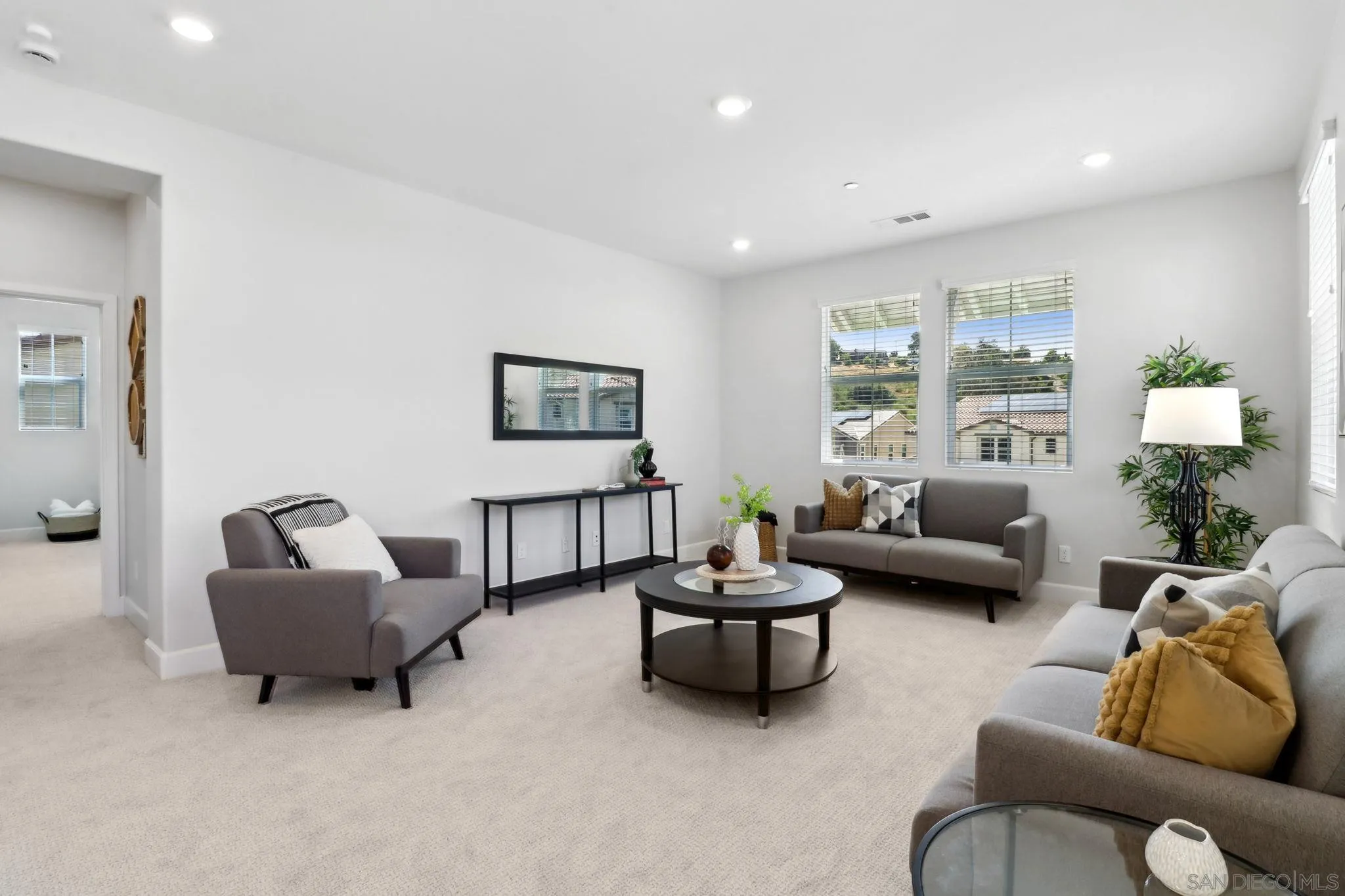 941 Lindbergh Drive San Marcos, CA 92069 - Photo 18 of 44 a living room with furniture and a potted plant
