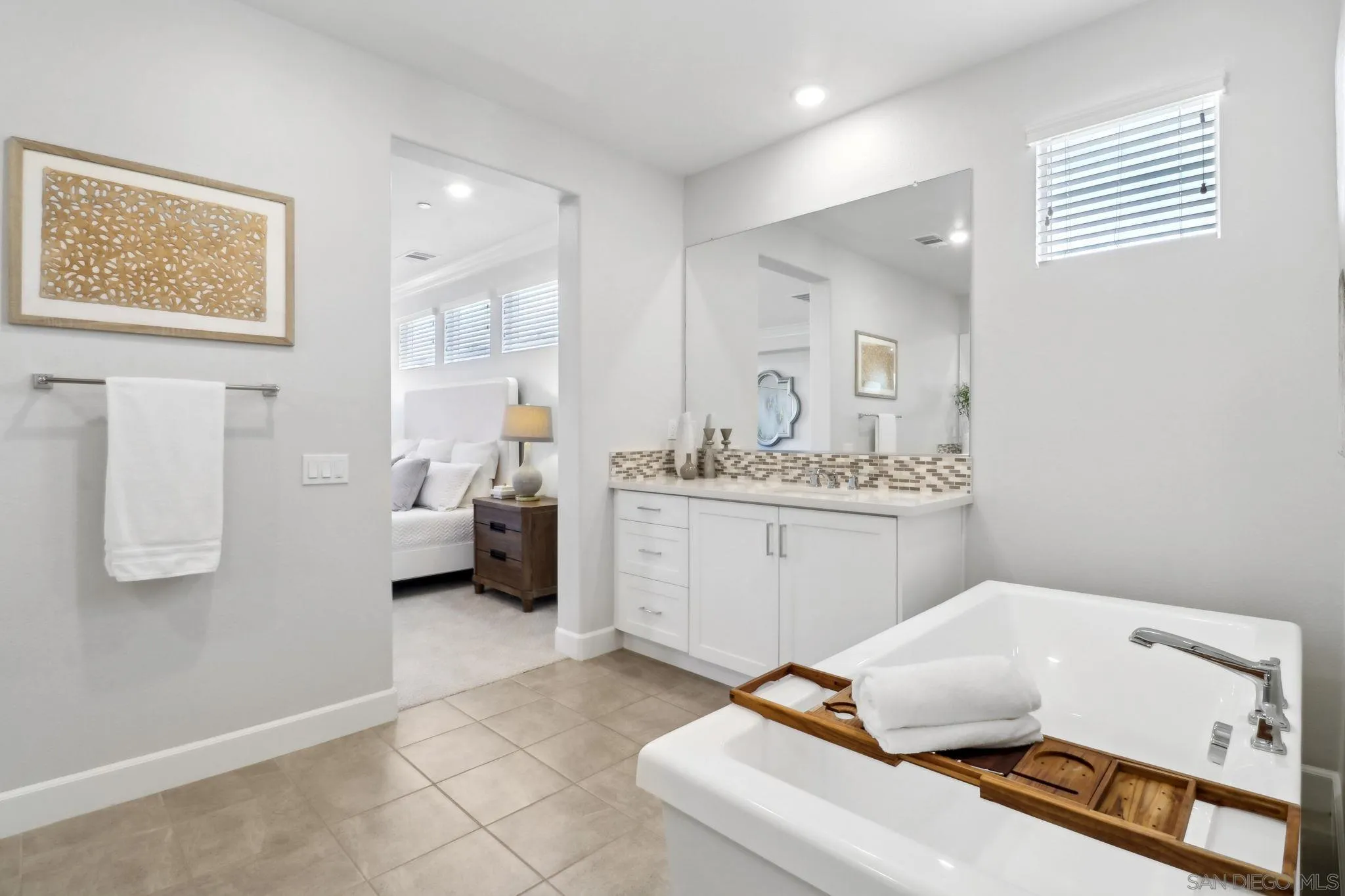 941 Lindbergh Drive San Marcos, CA 92069 - Photo 28 of 44 a bedroom with a bed and a couch