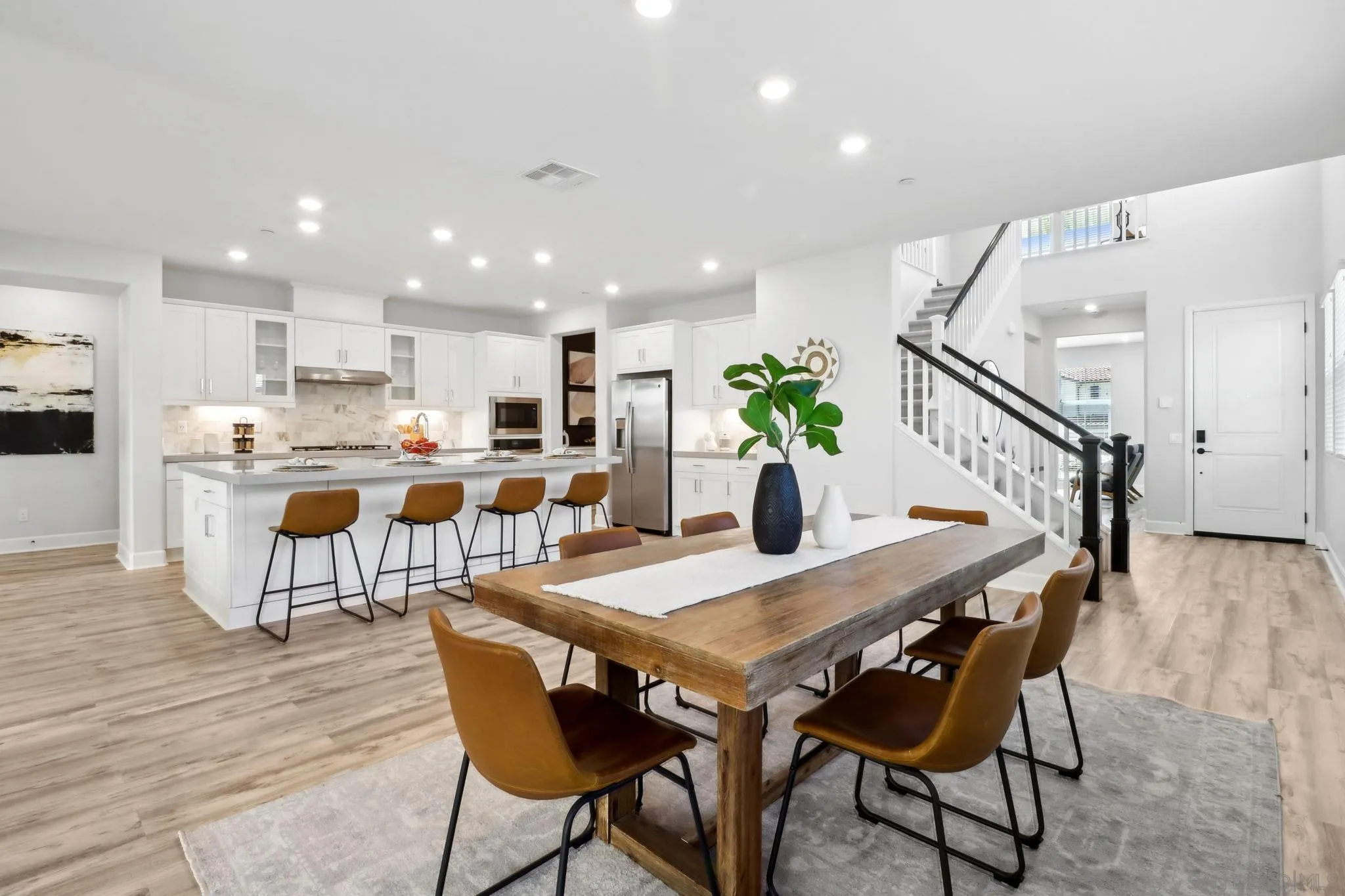 941 Lindbergh Drive San Marcos, CA 92069 - Photo 3 of 44 a dining room with furniture and wooden floor