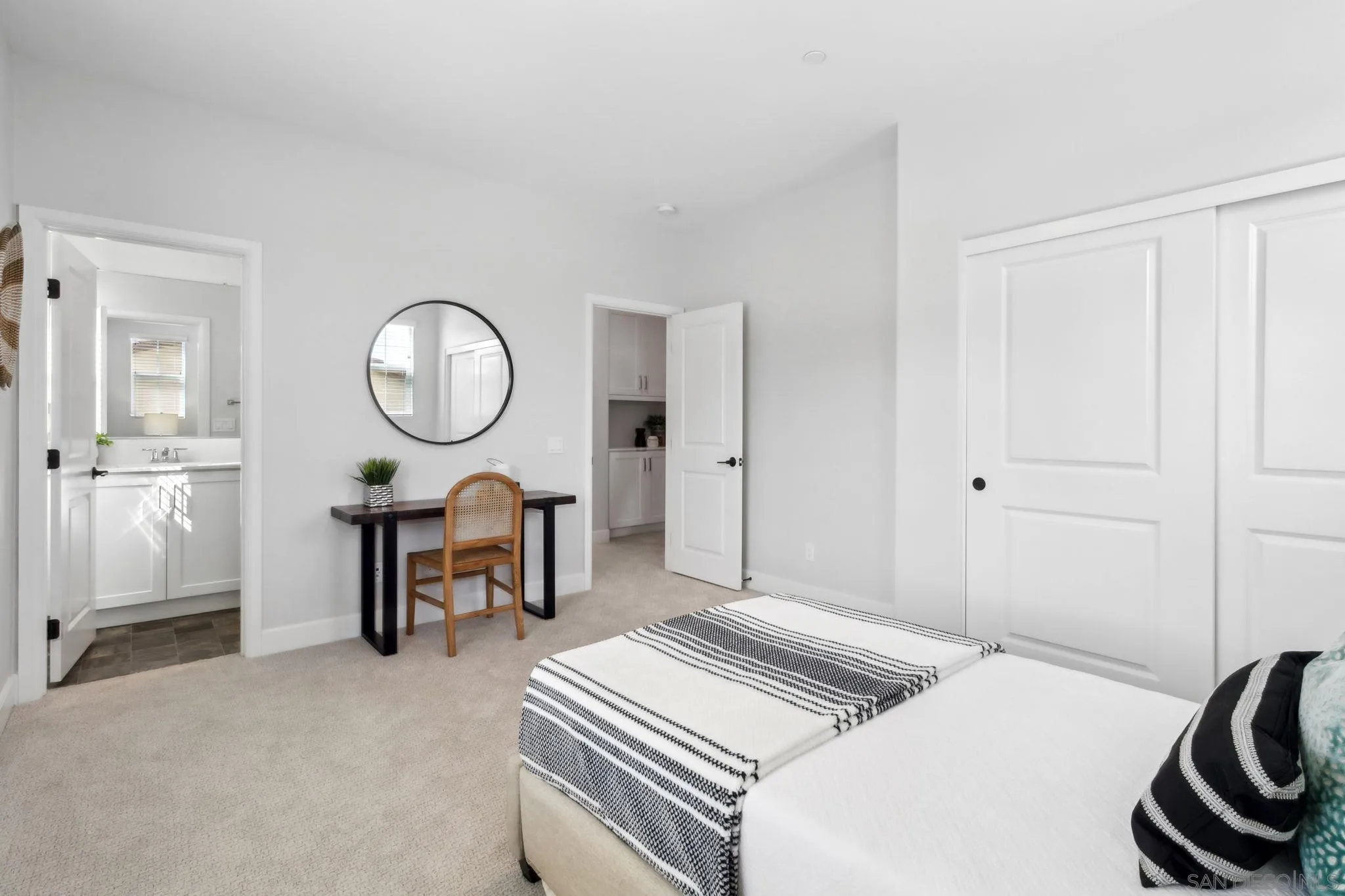 941 Lindbergh Drive San Marcos, CA 92069 - Photo 31 of 44 a bedroom with bed and a chandelier