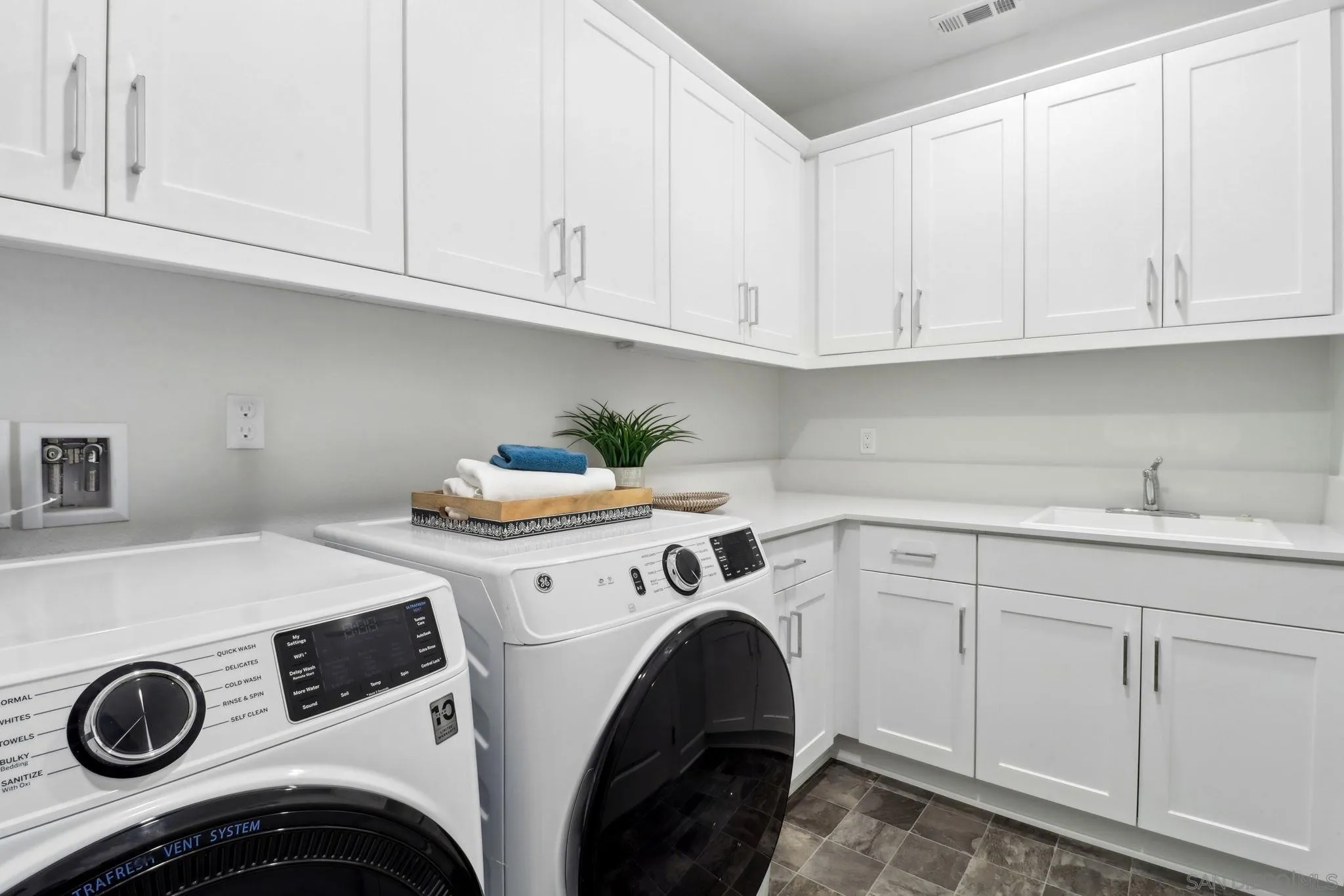 941 Lindbergh Drive San Marcos, CA 92069 - Photo 33 of 44 a utility room with sink dryer and washer
