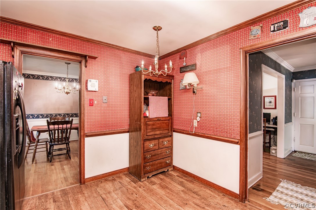 10960 Stepney Road Chester, VA 23831 - Photo 12 of 31 a view of a hallway with wooden floor and dining room