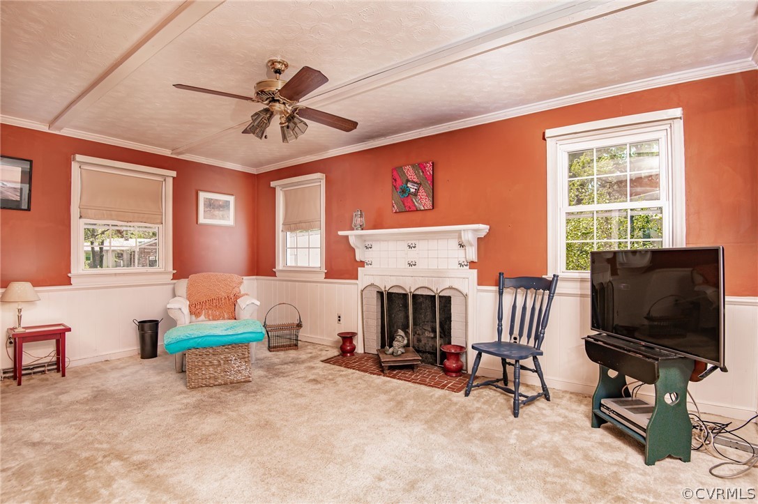 10960 Stepney Road Chester, VA 23831 - Photo 13 of 31 a living room with furniture a flat screen tv and a fireplace
