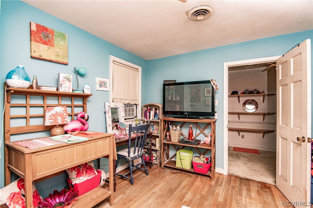 10960 Stepney Road Chester, VA 23831 - Photo 23 of 31 a living room with lots of furniture and a flat screen tv