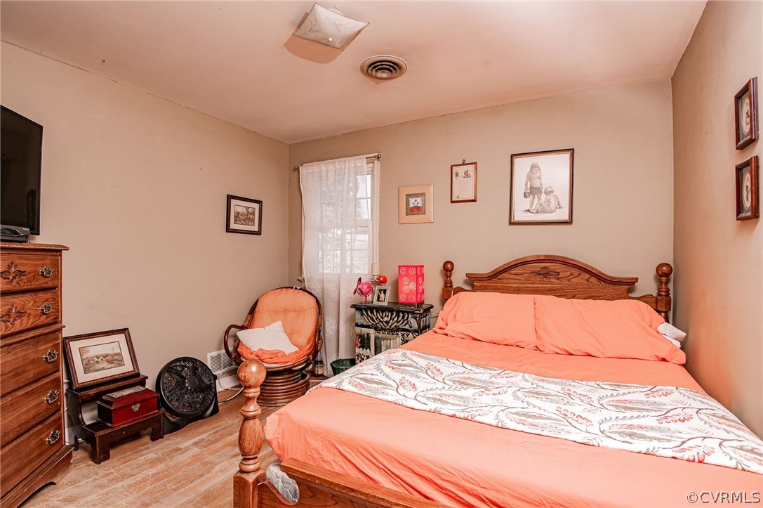 10960 Stepney Road Chester, VA 23831 - Photo 27 of 31 a bedroom with two beds and a flat screen tv