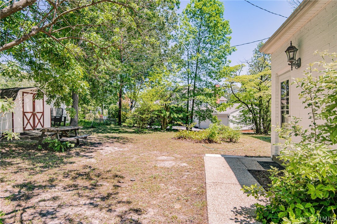 10960 Stepney Road Chester, VA 23831 - Photo 30 of 31 a view of a yard with plants and trees