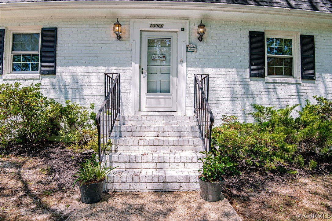 10960 Stepney Road Chester, VA 23831 - Photo 3 of 31 a front view of a house with a garden