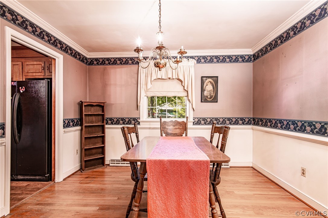 10960 Stepney Road Chester, VA 23831 - Photo 8 of 31 a view of a dining room with furniture window and wooden floor