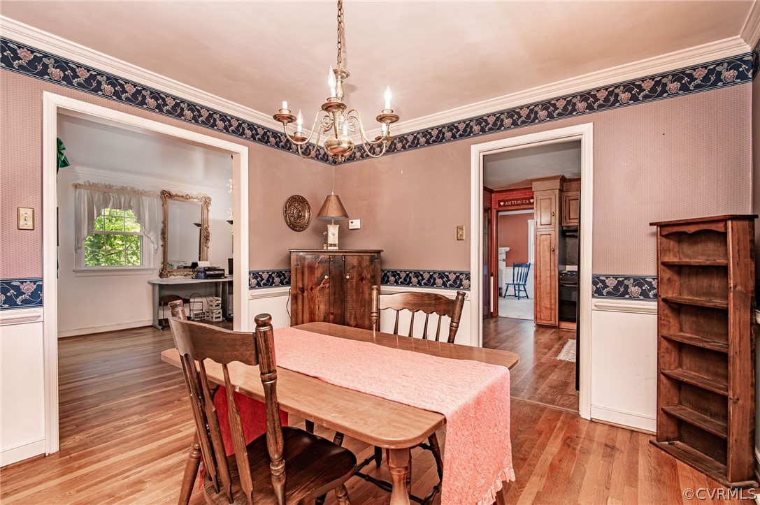 10960 Stepney Road Chester, VA 23831 - Photo 9 of 31 a view of a dining room with furniture and wooden floor