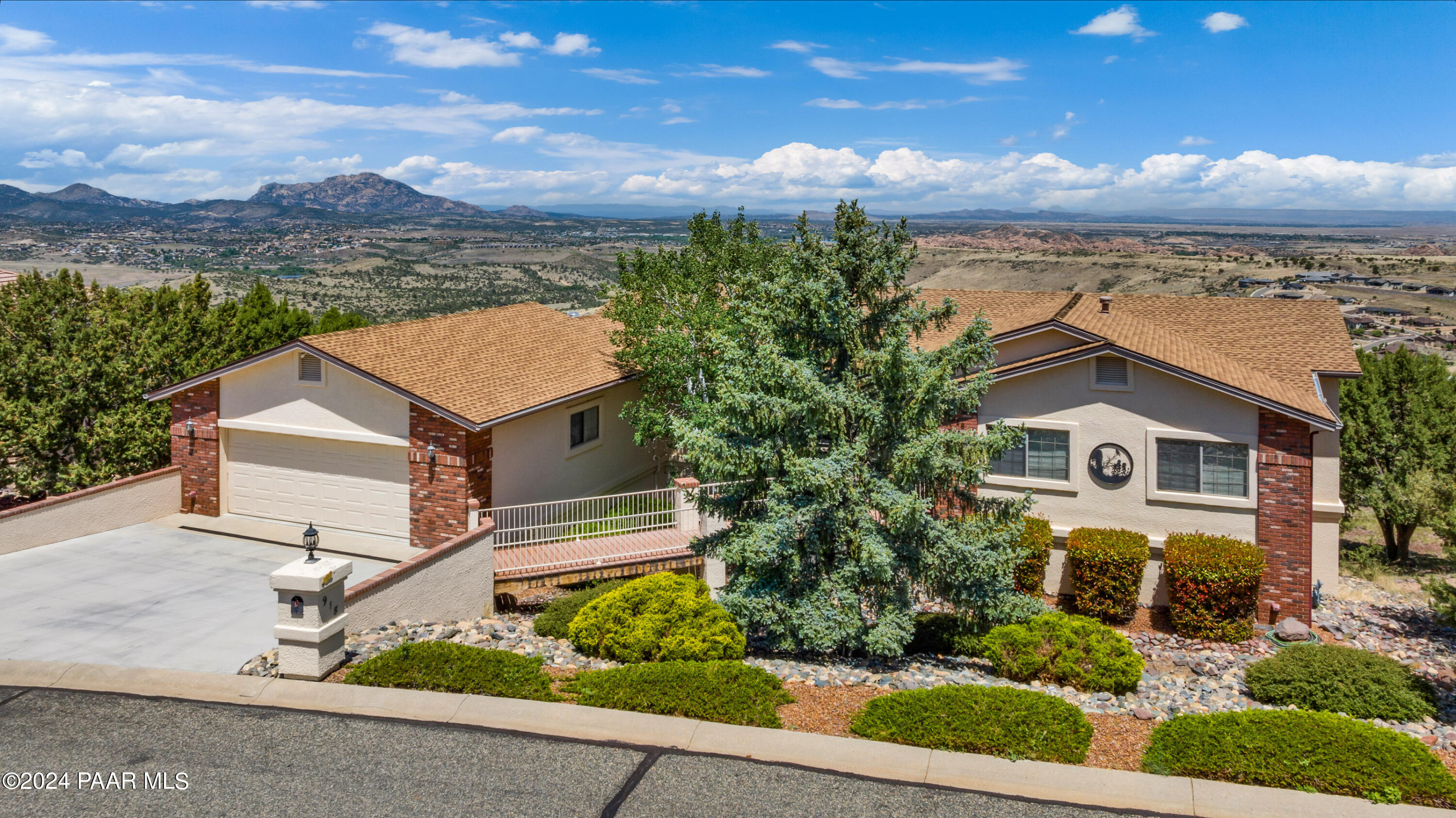 918 Yavapai Hills Drive Prescott, AZ 86301 - Photo 1 of 31 front view of a house with a garden