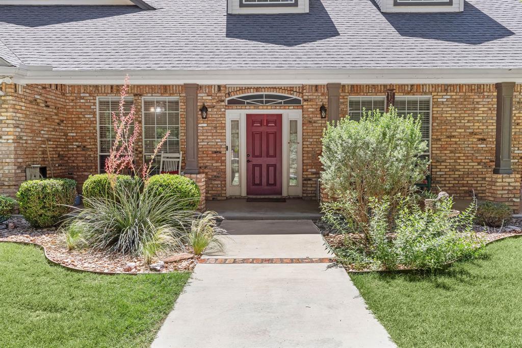 145 Indian Trail Decatur, TX 76234 - Photo 2 of 40 a view of a entryway door front of house