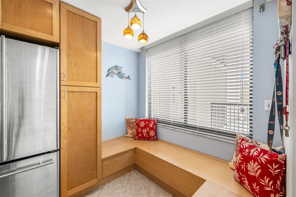 9495 Blind Pass Road, Unit 204 St. Pete Beach, FL 33706 - Photo 11 of 36 a bedroom with a bed and a window