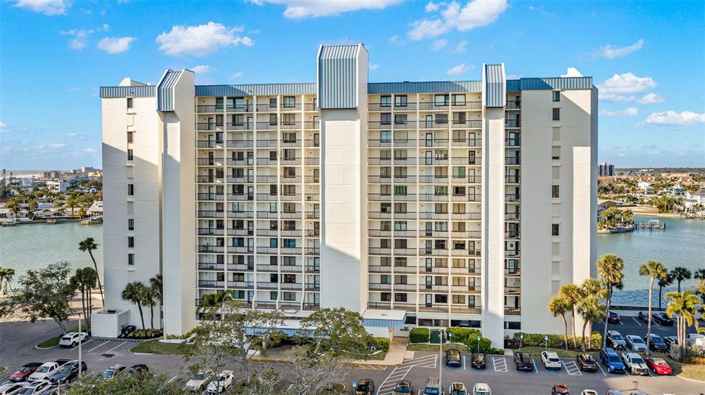 9495 Blind Pass Road, Unit 204 St. Pete Beach, FL 33706 - Photo 2 of 36 a view of a tall building