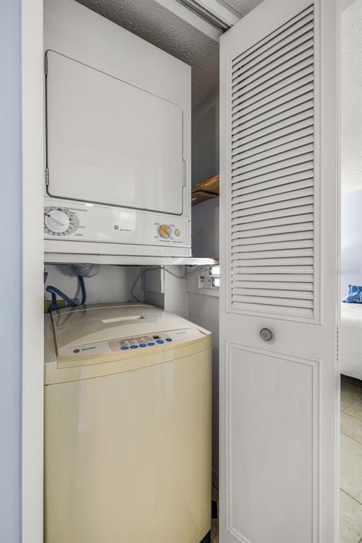 9495 Blind Pass Road, Unit 204 St. Pete Beach, FL 33706 - Photo 23 of 36 a utility room with dryer and washer