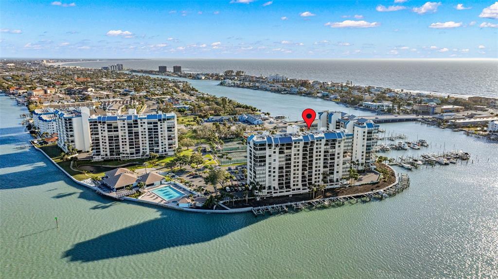 9495 Blind Pass Road, Unit 204 St. Pete Beach, FL 33706 - Photo 27 of 36 a view of a balcony with city