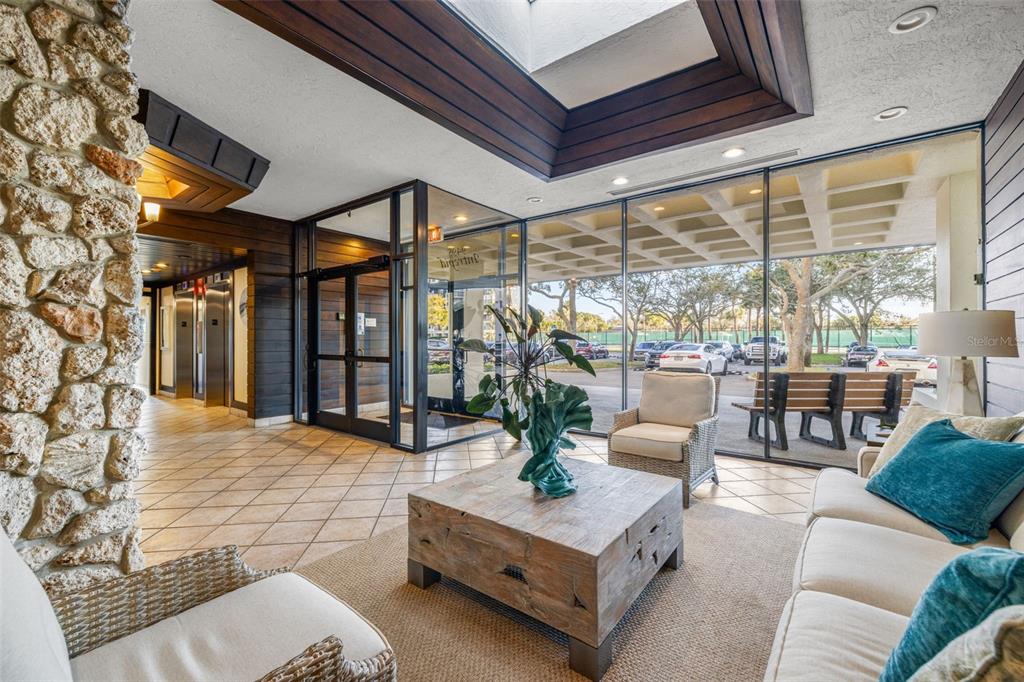9495 Blind Pass Road, Unit 204 St. Pete Beach, FL 33706 - Photo 36 of 36 a living room with furniture and a large window