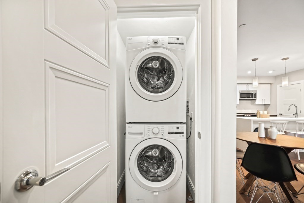 425 Lagrange Street, Unit 109 Boston, MA 02132 - Photo 13 of 42 a view of a kitchen with washer and dryer
