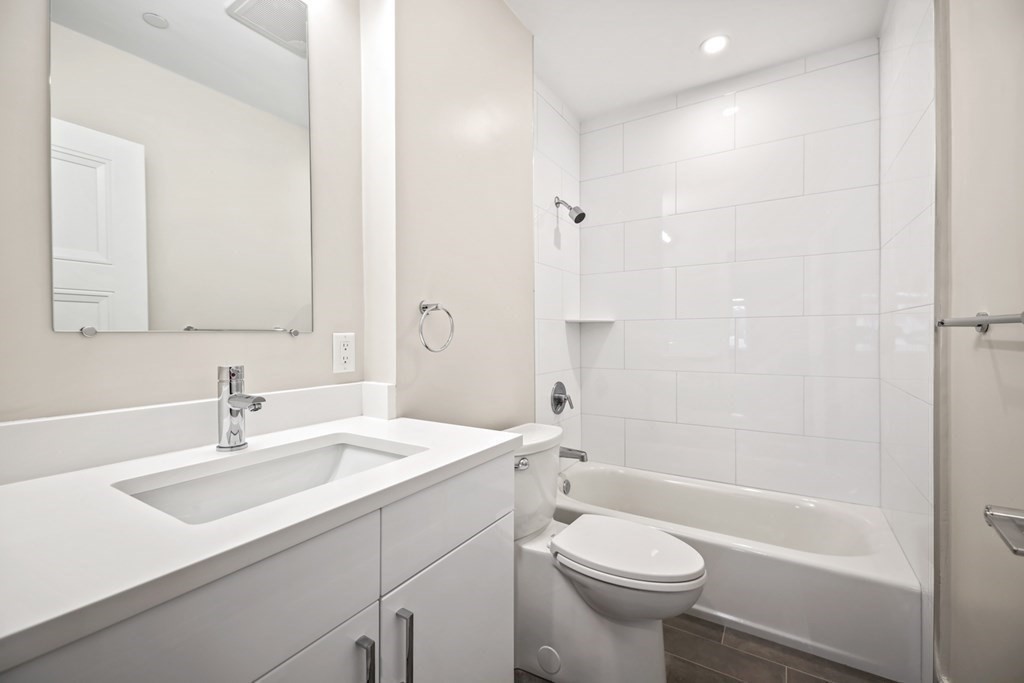 425 Lagrange Street, Unit 109 Boston, MA 02132 - Photo 33 of 42 a bathroom with a sink toilet and shower