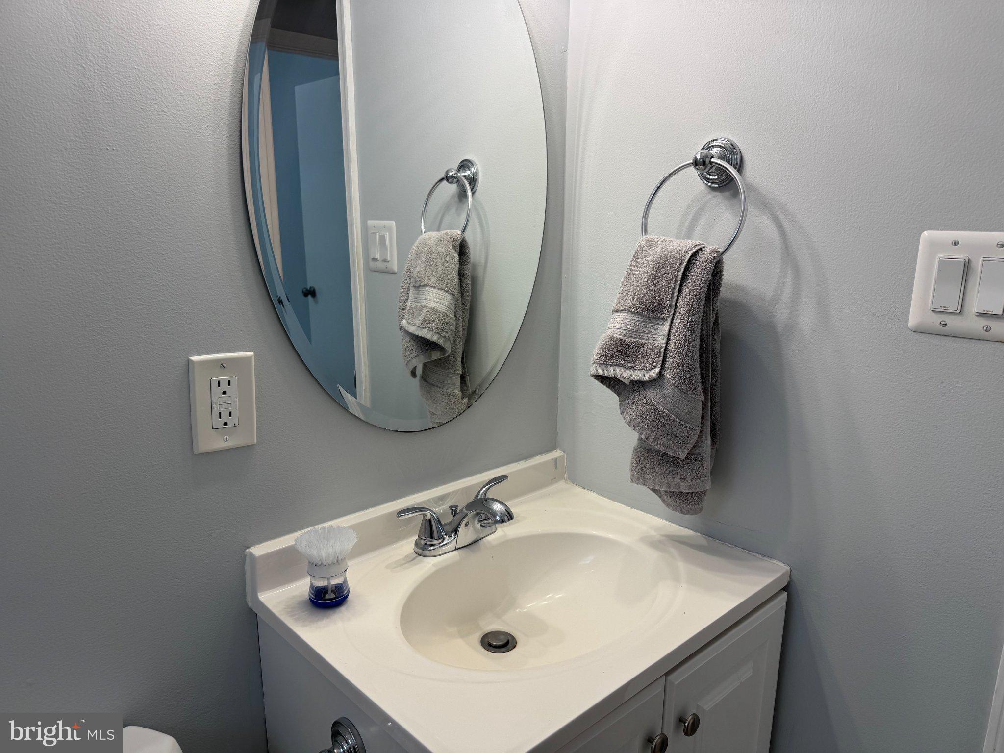 6603 Huntsman Boulevard Springfield, VA 22152 - Photo 36 of 64 Sleek bathroom with modern elegance.