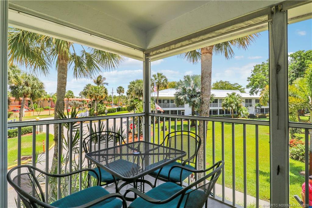 1852 Southwest Palm City Road, Unit 201 Stuart, FL 34994 - Photo 8 of 34 a view of a chairs and table in patio