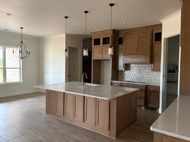 120 Turtle Back Ridge Decatur, TX 76234 - Photo 3 of 9 a kitchen with kitchen island a counter top space stainless steel appliances and a chandelier