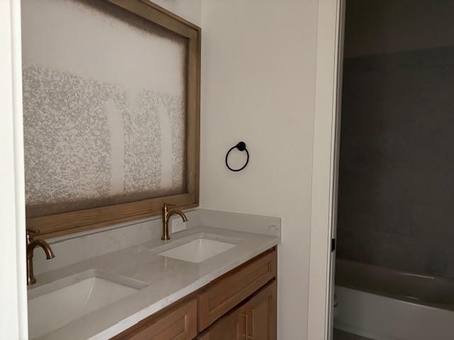 120 Turtle Back Ridge Decatur, TX 76234 - Photo 7 of 9 a bathroom with a sink and mirror