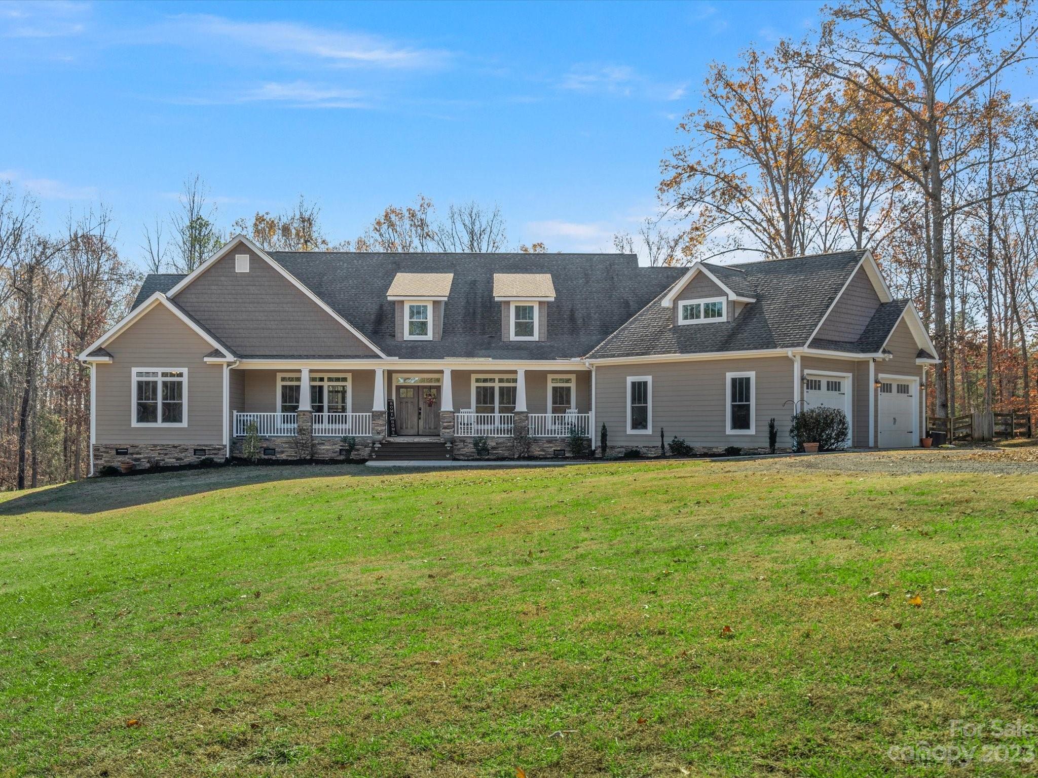 810 Sutton Spring Road York, SC 29745 - Photo 1 of 47 a front view of a house with garden