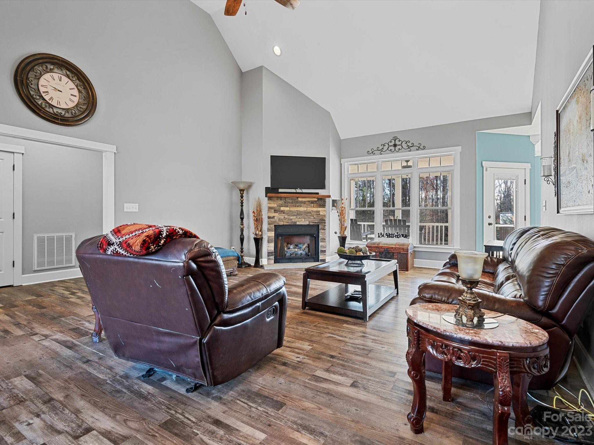 810 Sutton Spring Road York, SC 29745 - Photo 12 of 47 a living room with furniture a fireplace and a flat screen tv