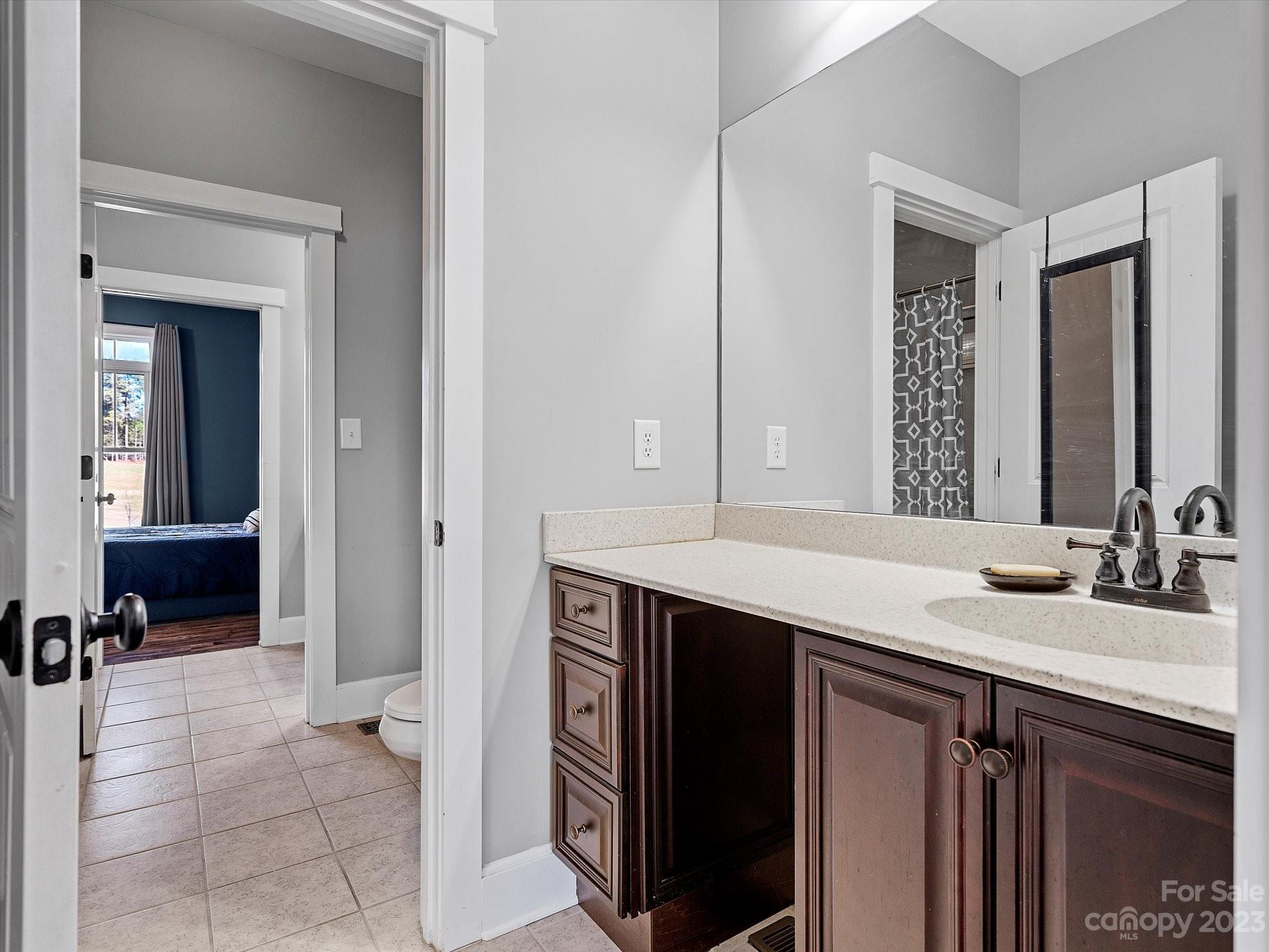 810 Sutton Spring Road York, SC 29745 - Photo 16 of 47 a bathroom with a sink and a mirror