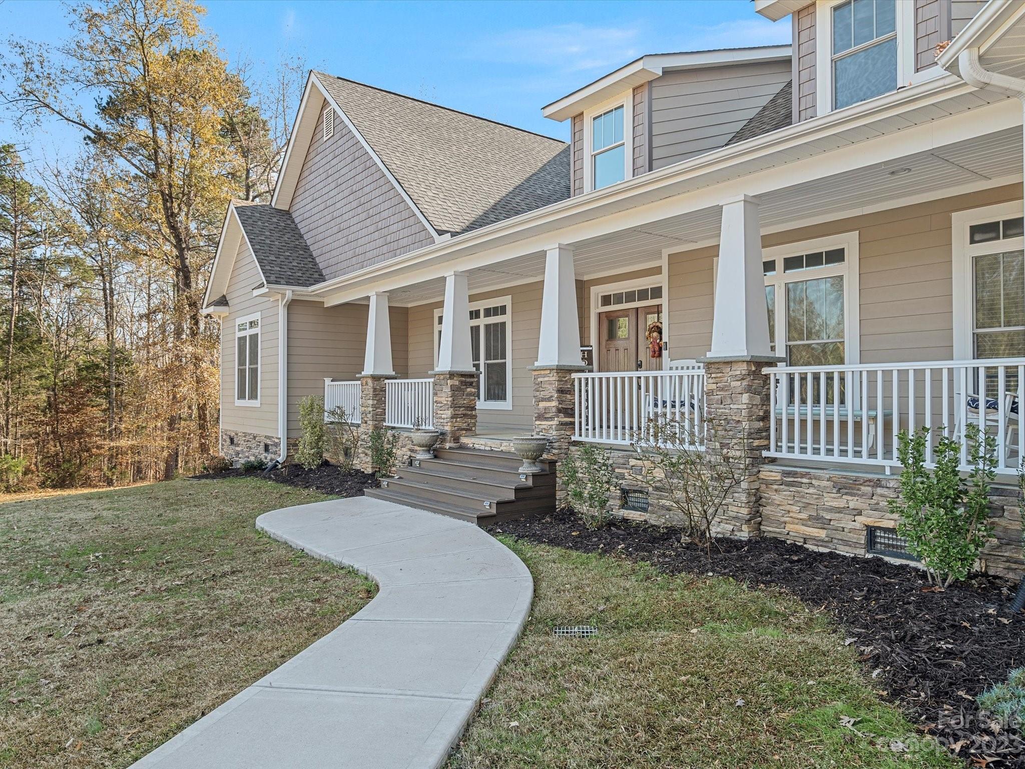 810 Sutton Spring Road York, SC 29745 - Photo 2 of 47 a front view of a house with garden