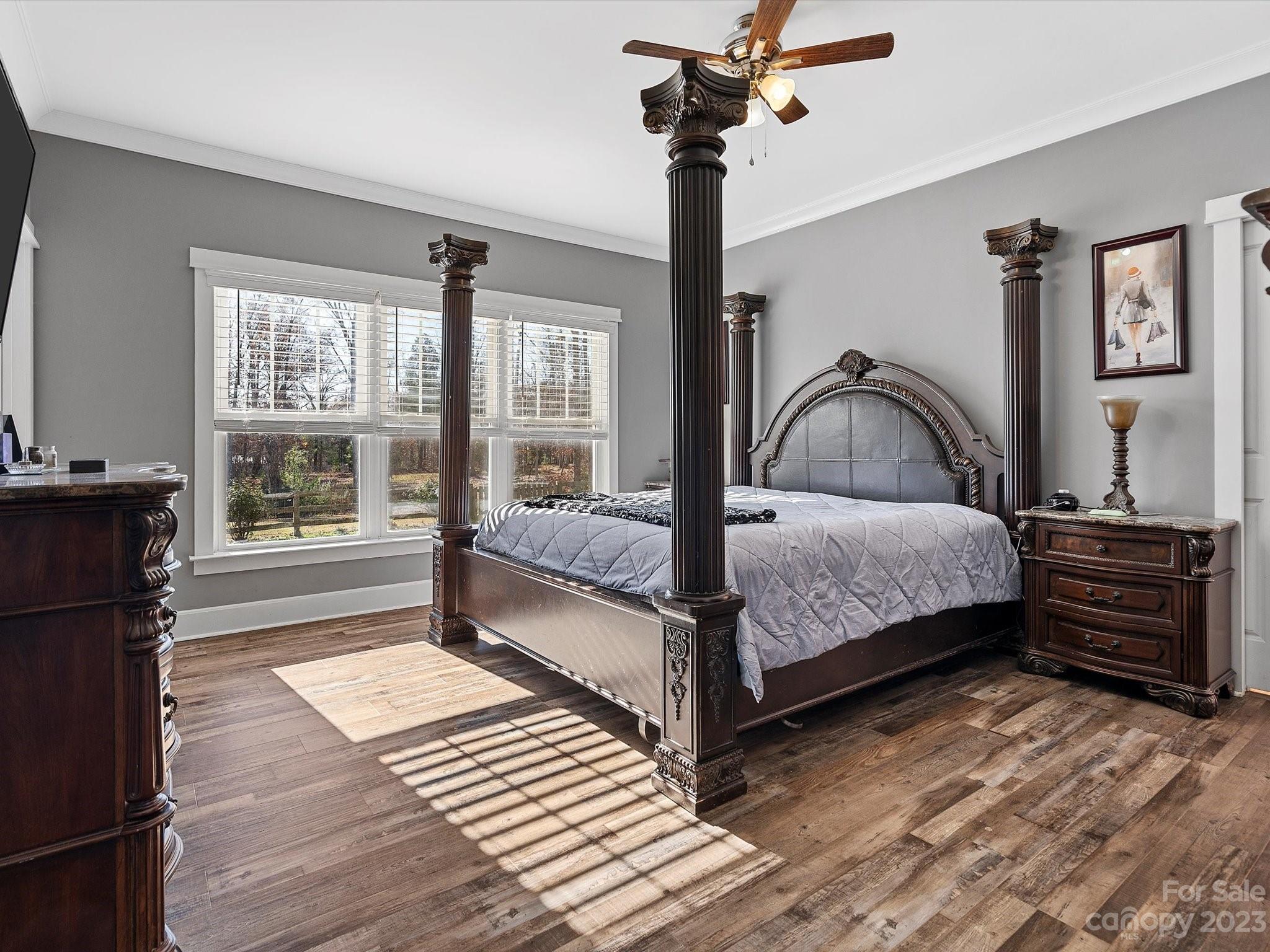 810 Sutton Spring Road York, SC 29745 - Photo 22 of 47 a bedroom with a bed lamp and a window