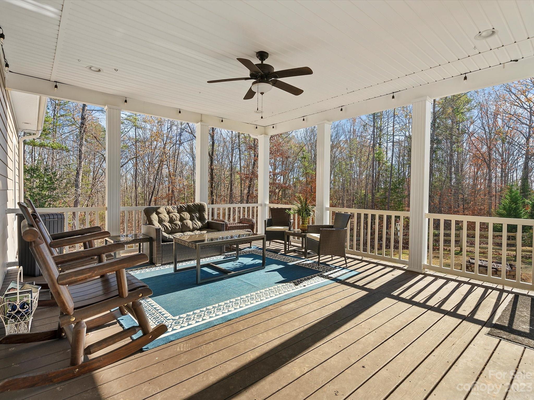 810 Sutton Spring Road York, SC 29745 - Photo 25 of 47 a living room with furniture floor to ceiling window and wooden floor