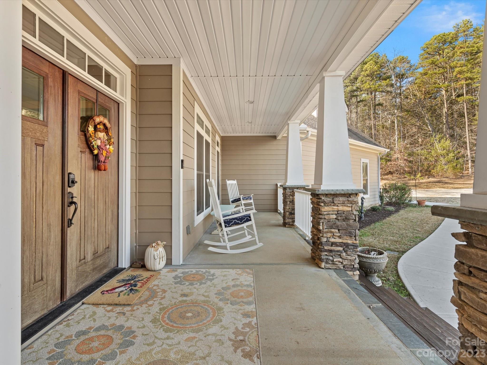 810 Sutton Spring Road York, SC 29745 - Photo 6 of 47 a view of a patio with table and chairs and potted plants