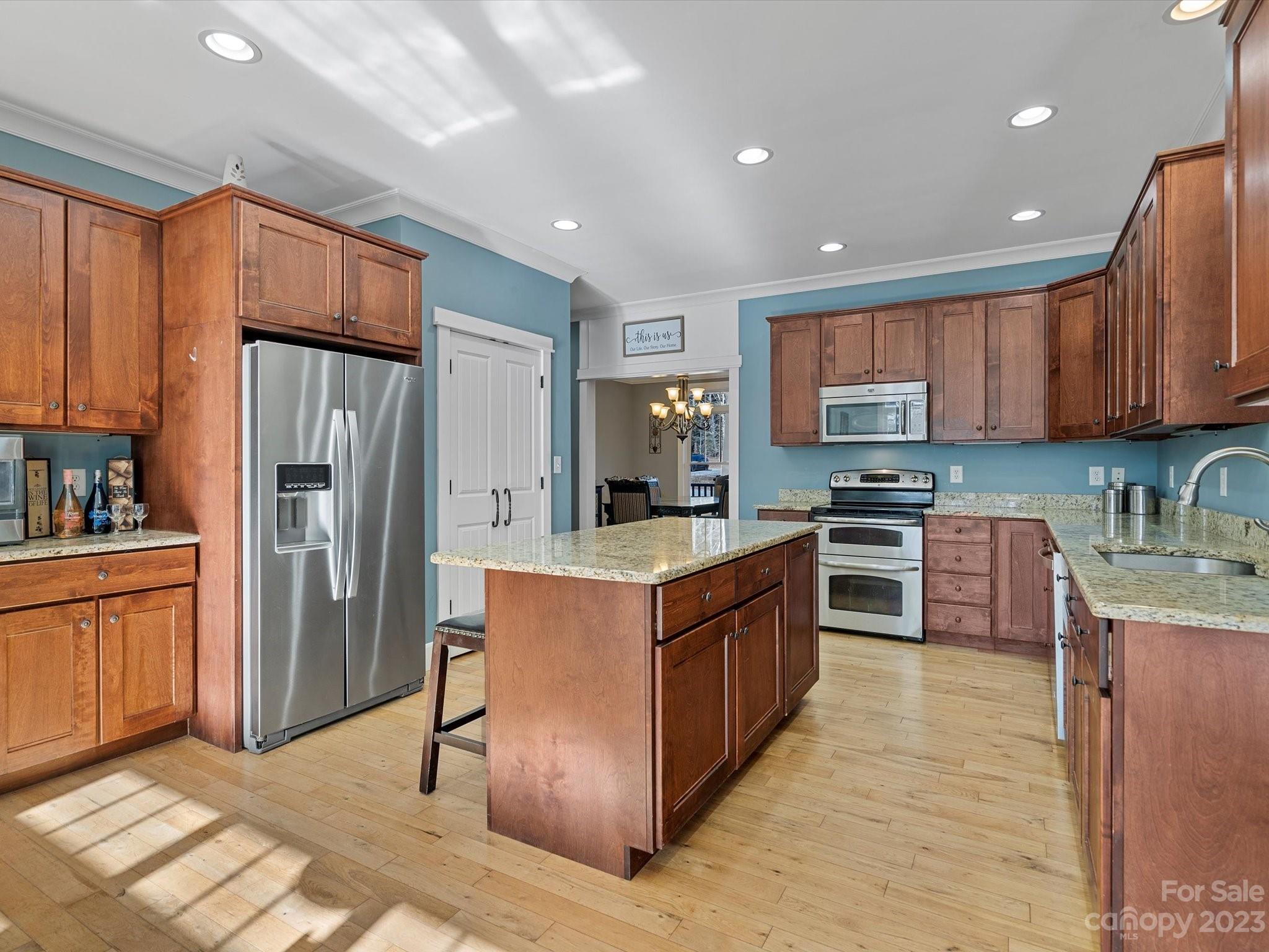 810 Sutton Spring Road York, SC 29745 - Photo 9 of 47 a kitchen with stainless steel appliances granite countertop a refrigerator stove a sink and dishwasher