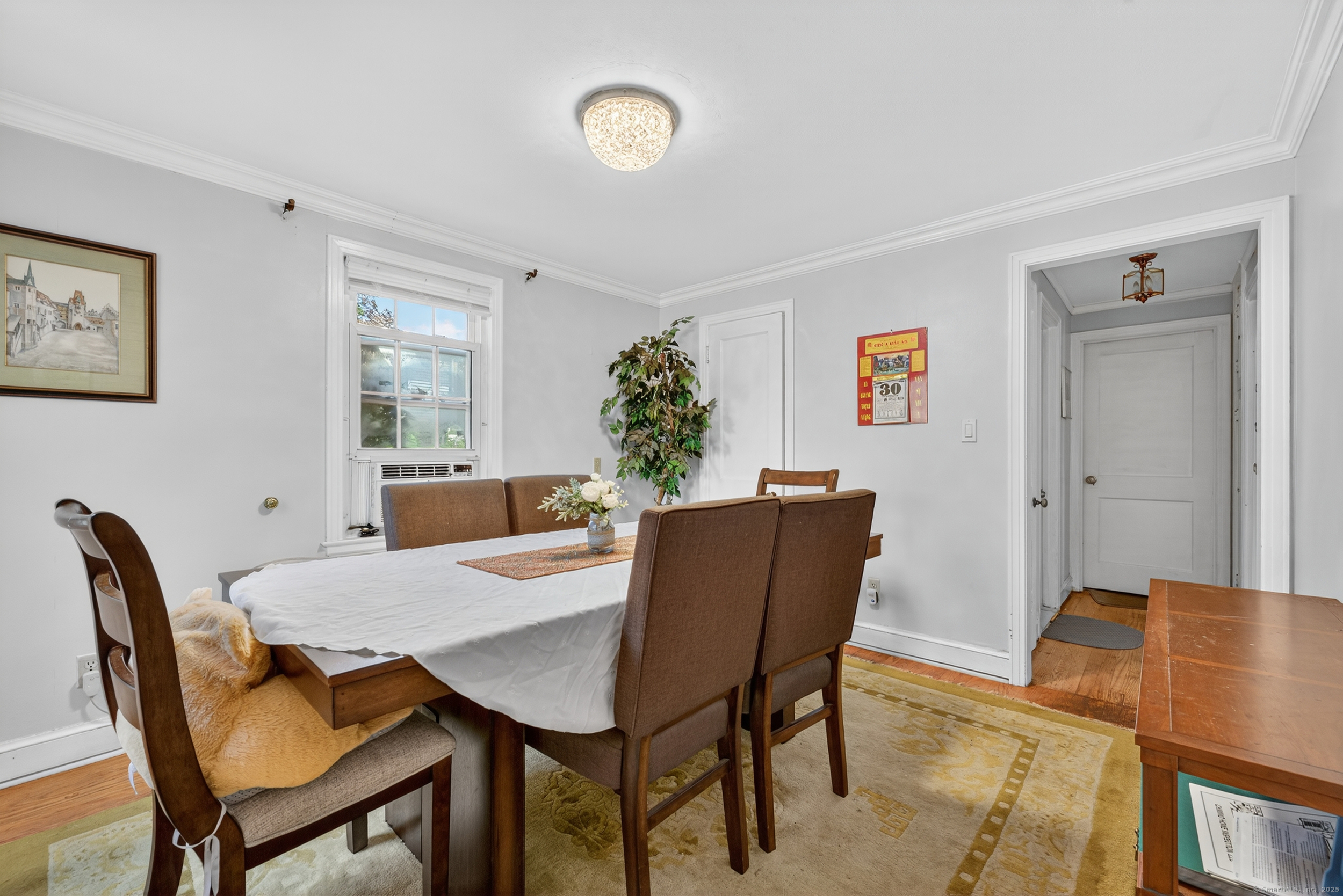 15 St John Street Manchester, CT 06040 - Photo 12 of 36 a view of a dining room with furniture and a potted plant