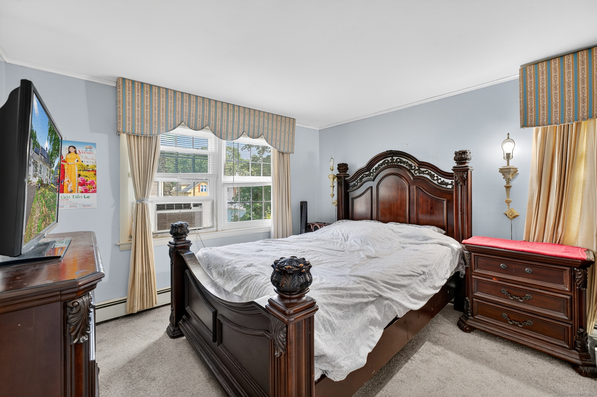 15 St John Street Manchester, CT 06040 - Photo 21 of 36 a bedroom with a bed and a flat tv screen on dresser